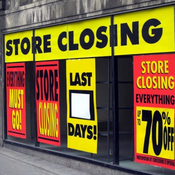 Large,Printed,Signs,In,A,Department,Store,Window,Announcing,Store
